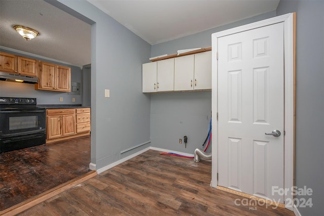 laundry room with a textured ceiling and dark hardwood / wood-style flooring