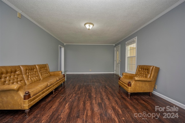 unfurnished room featuring a textured ceiling, ornamental molding, and dark hardwood / wood-style floors