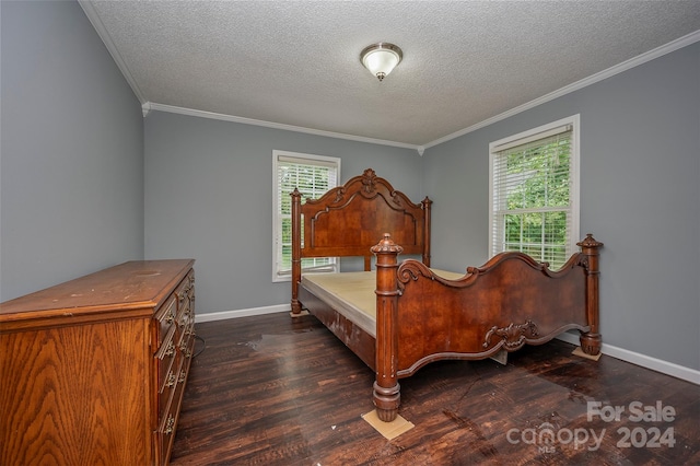 bedroom with multiple windows, dark hardwood / wood-style floors, crown molding, and a textured ceiling