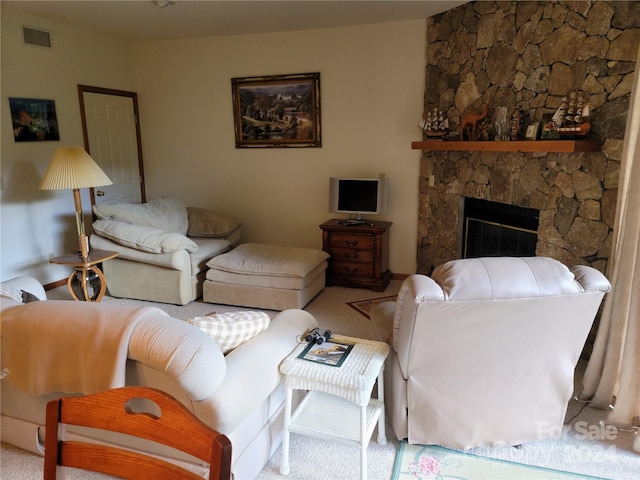 carpeted living room featuring a fireplace