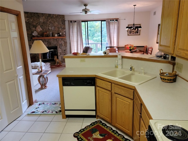 kitchen featuring hanging light fixtures, white dishwasher, a fireplace, ceiling fan with notable chandelier, and kitchen peninsula