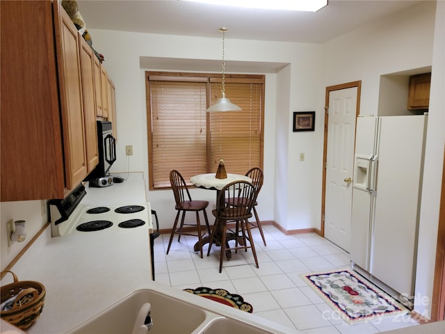 dining space featuring light tile patterned flooring