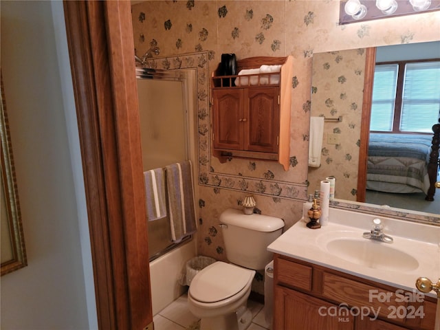 full bathroom featuring shower / bath combination with glass door, vanity, toilet, and tile patterned floors