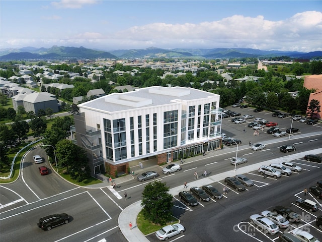 drone / aerial view featuring a mountain view