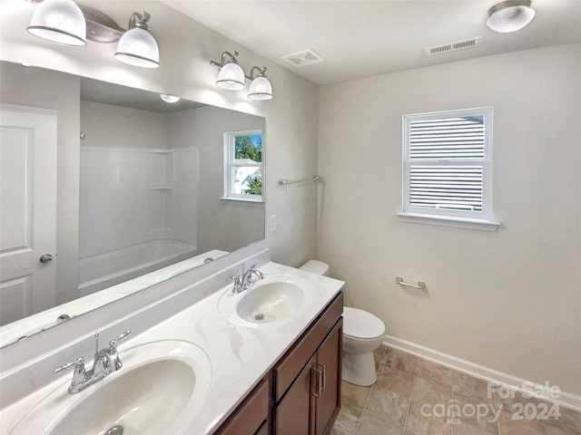 full bathroom featuring vanity, toilet, shower / tub combination, and tile patterned floors