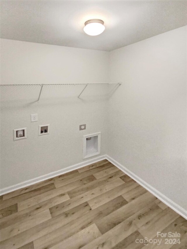 laundry area with hookup for a washing machine and wood-type flooring