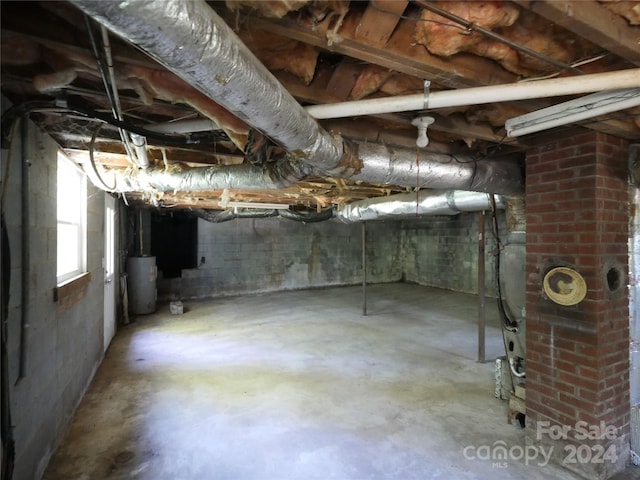 basement featuring water heater