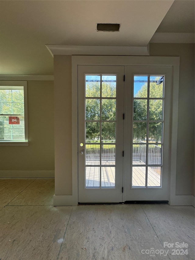 doorway to outside featuring plenty of natural light