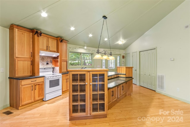 kitchen featuring vaulted ceiling, pendant lighting, a center island, electric stove, and light wood-type flooring