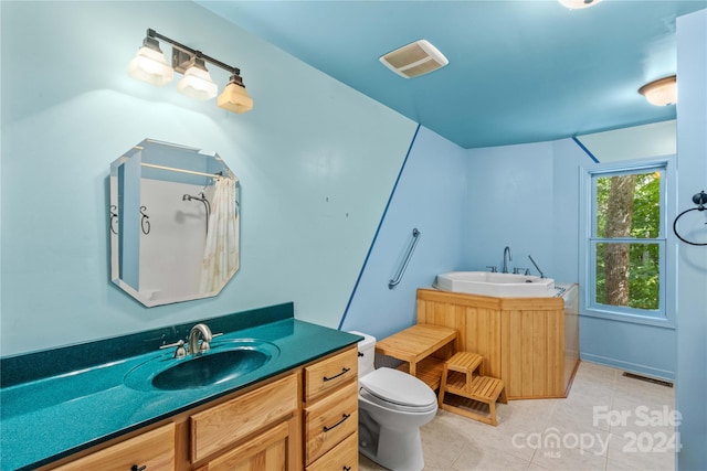 bathroom with vanity, toilet, walk in shower, and tile patterned floors