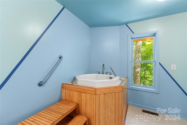 bathroom featuring a healthy amount of sunlight, sink, and tile patterned floors