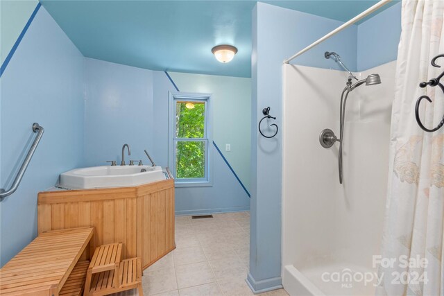 bathroom featuring vanity, curtained shower, and tile patterned floors