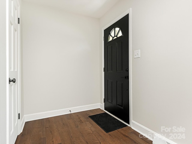 entrance foyer featuring dark hardwood / wood-style floors