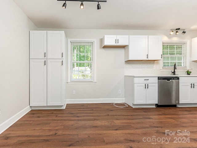 kitchen featuring dark wood-type flooring, white cabinets, backsplash, and dishwasher