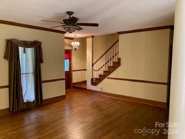 unfurnished room featuring a textured ceiling, crown molding, ceiling fan with notable chandelier, and dark hardwood / wood-style flooring