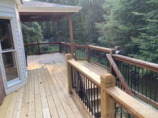 wooden terrace with a gazebo