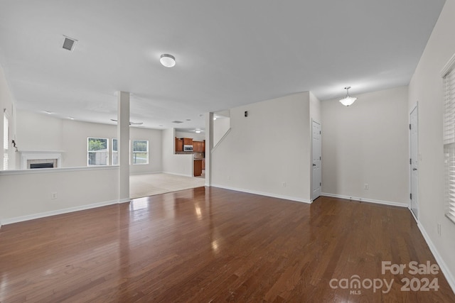 unfurnished living room featuring wood-type flooring