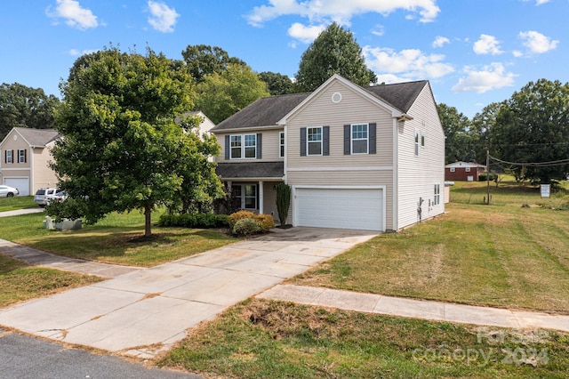 view of front of house featuring a garage and a front yard