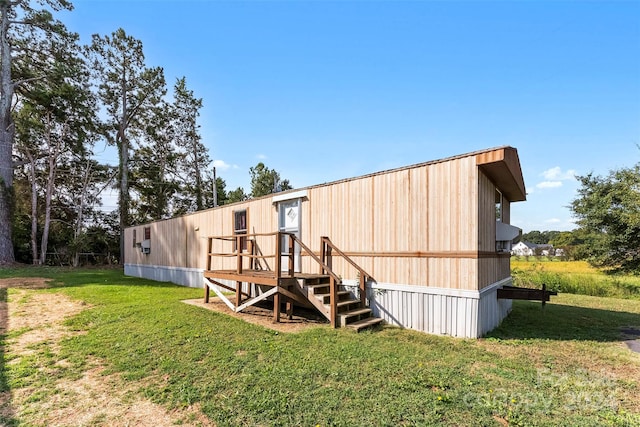 view of outbuilding with a yard