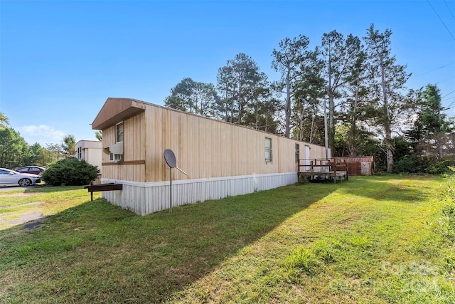 view of side of property featuring a yard