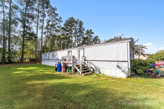 view of outbuilding with a lawn