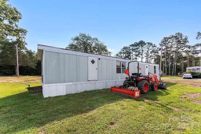 view of outdoor structure with a yard