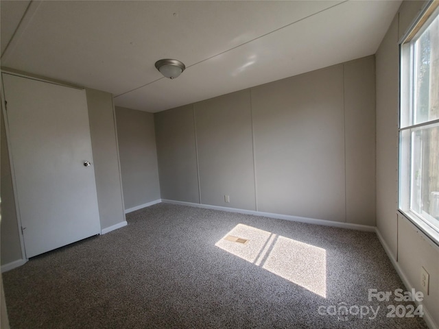 unfurnished room with carpet