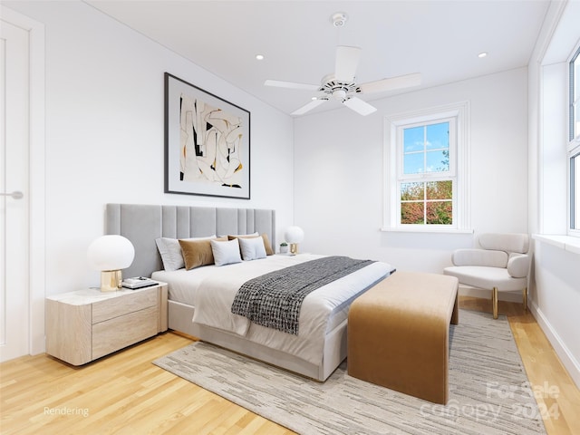 bedroom with light hardwood / wood-style flooring and ceiling fan