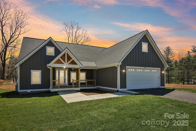 40 Haywood Park Dr, Hendersonville, NC 28791 - modern farmhouse featuring a porch, a front lawn, driveway, and board and batten siding