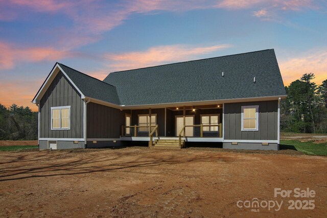 40 Haywood Park Dr, Hendersonville, NC 28791 - rear view of house with crawl space, board and batten siding, covered porch, and a shingled roof