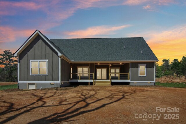 40 Haywood Park Dr, Hendersonville, NC 28791 - view of front facade with covered porch and board and batten siding