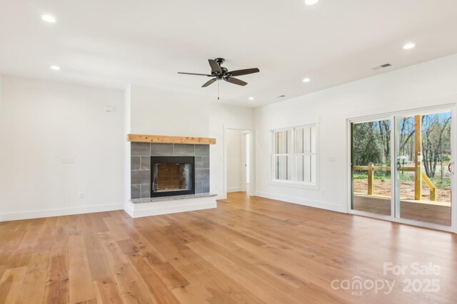 40 Haywood Park Dr, Hendersonville, NC 28791 - unfurnished living room with ceiling fan, light wood-style flooring, recessed lighting, a fireplace, and baseboards