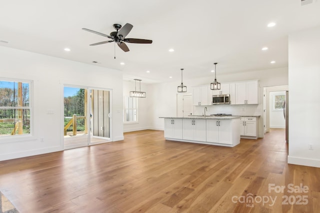 40 Haywood Park Dr, Hendersonville, NC 28791 - kitchen featuring appliances with stainless steel finishes, baseboards, white cabinets, and recessed lighting