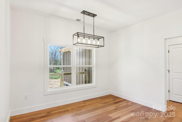 40 Haywood Park Dr, Hendersonville, NC 28791 - unfurnished dining area featuring baseboards and light wood-style flooring