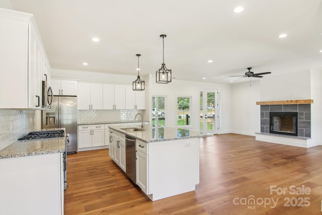 40 Haywood Park Dr, Hendersonville, NC 28791 - kitchen with a sink, appliances with stainless steel finishes, a ceiling fan, a fireplace, and recessed lighting