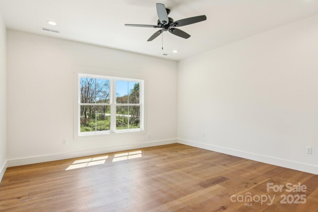 40 Haywood Park Dr, Hendersonville, NC 28791 - unfurnished room with baseboards, light wood-style flooring, a ceiling fan, and recessed lighting