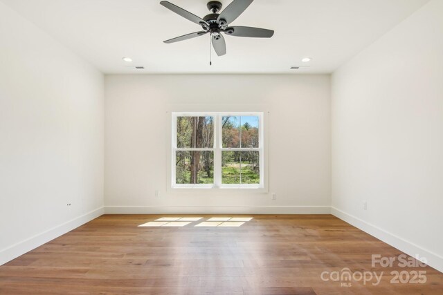 40 Haywood Park Dr, Hendersonville, NC 28791 - spare room with baseboards, ceiling fan, light wood-style floors, and recessed lighting