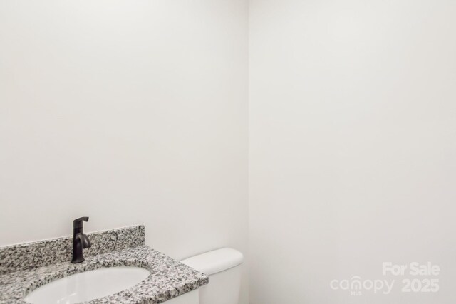 40 Haywood Park Dr, Hendersonville, NC 28791 - half bathroom with toilet and vanity