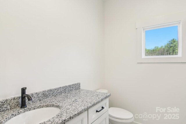 40 Haywood Park Dr, Hendersonville, NC 28791 - half bathroom with vanity and toilet