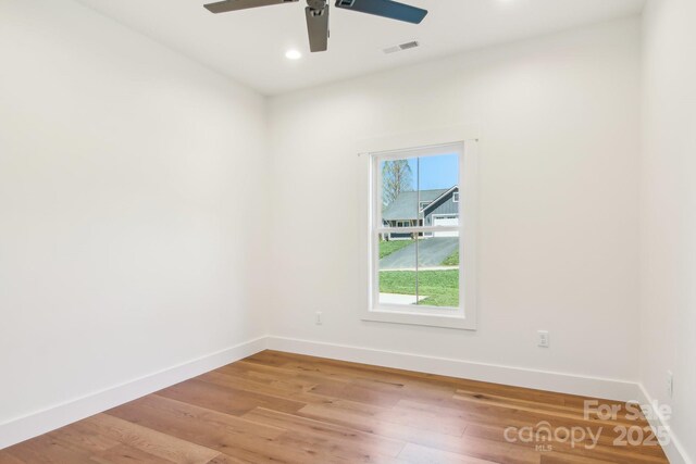 40 Haywood Park Dr, Hendersonville, NC 28791 - unfurnished room with a ceiling fan, baseboards, light wood-style floors, and recessed lighting