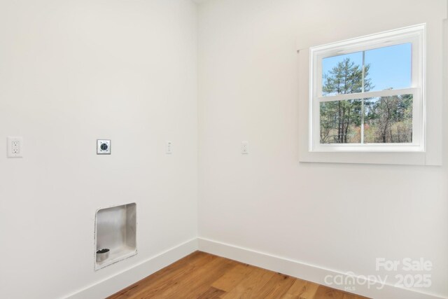 40 Haywood Park Dr, Hendersonville, NC 28791 - laundry area featuring baseboards, hookup for an electric dryer, and light wood-style floors