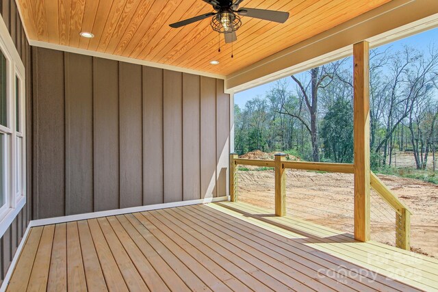 40 Haywood Park Dr, Hendersonville, NC 28791 - deck featuring a ceiling fan and view of scattered trees