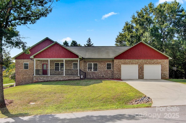 craftsman-style home with a porch, a garage, and a front yard