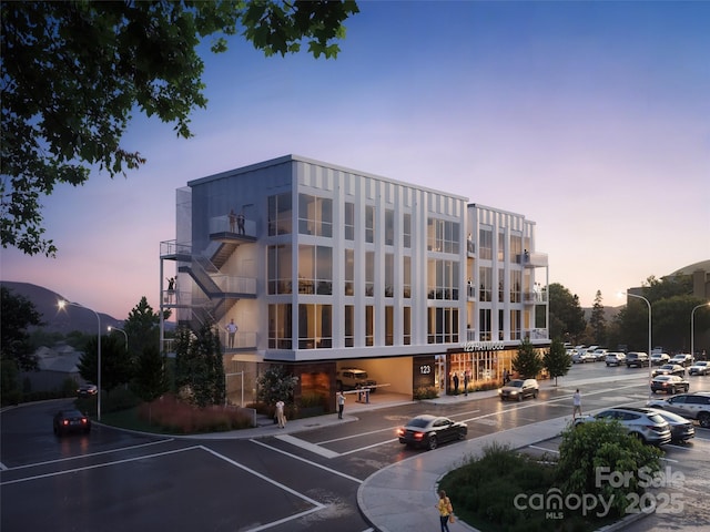 view of outdoor building at dusk