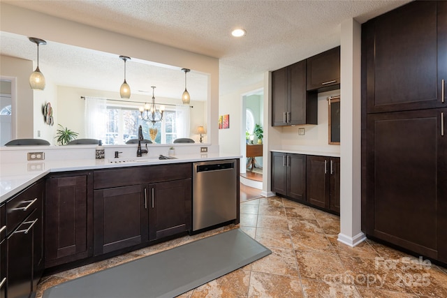 kitchen featuring stainless steel dishwasher, dark brown cabinetry, sink, and a textured ceiling