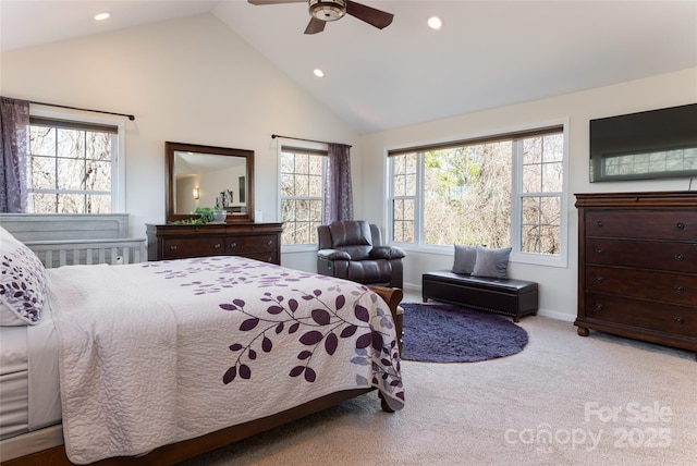 bedroom featuring ceiling fan, light colored carpet, and high vaulted ceiling