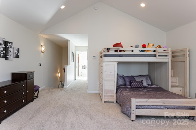 bedroom featuring light carpet and vaulted ceiling