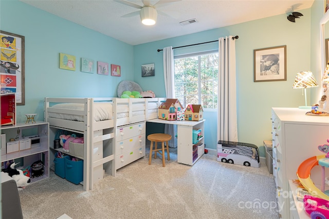 bedroom with ceiling fan and light carpet