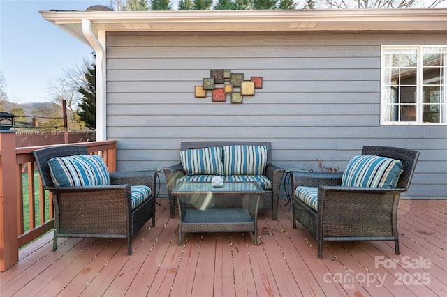 wooden terrace featuring outdoor lounge area