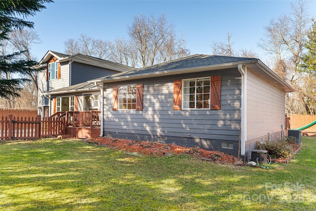 view of side of home with a lawn